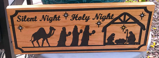 Wooden sign with nativity scene and 'Silent Night Holy Night' text