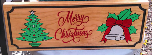 Wooden Christmas sign with tree, bell, and holly design on a wooden background