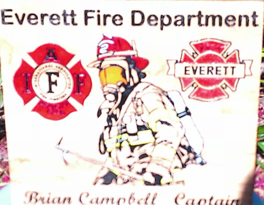 Firefighter badge with 'Everett Fire Department' text and logo