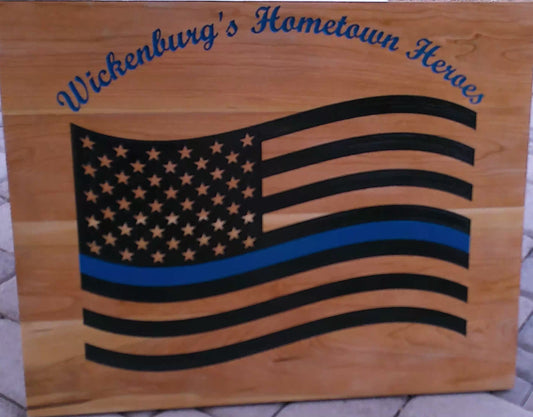 Wooden plaque with American flag design and 'Wickenburg's Hometown Heroes' text.