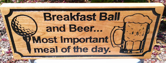 Wooden sign with 'Breakfast Ball and Beer... Most Important meal of the day.' text and graphics.