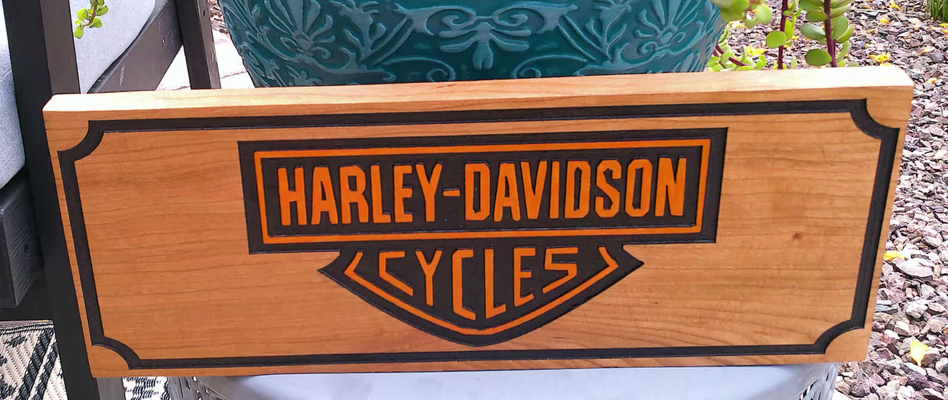 Harley-Davidson sign with wooden finish and black logo