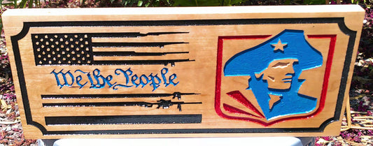 Wooden plaque with American flag, eagle emblem, and 'We the People' text.